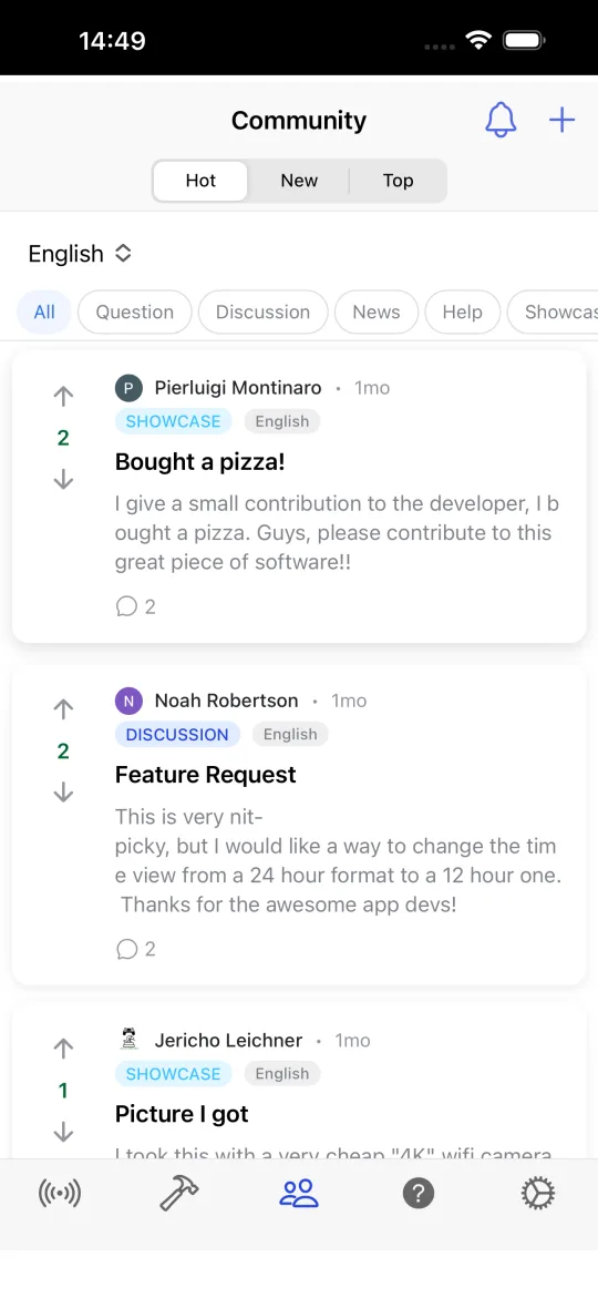 Community screen with posts sorted by Hot, New and Top, tags for question, discussion, news, help and showcase, and a language filter.