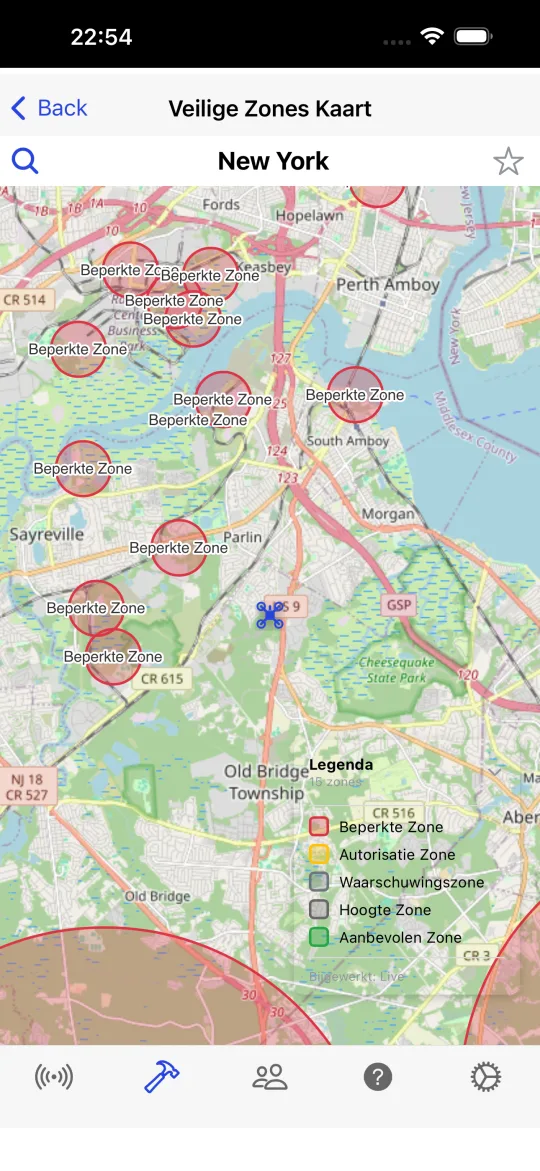 Kaart met veilige zones, rode cirkels voor beperkte zones en een legenda voor beperkte, autorisatie-, waarschuwings-, hoogte- en aanbevolen zones.